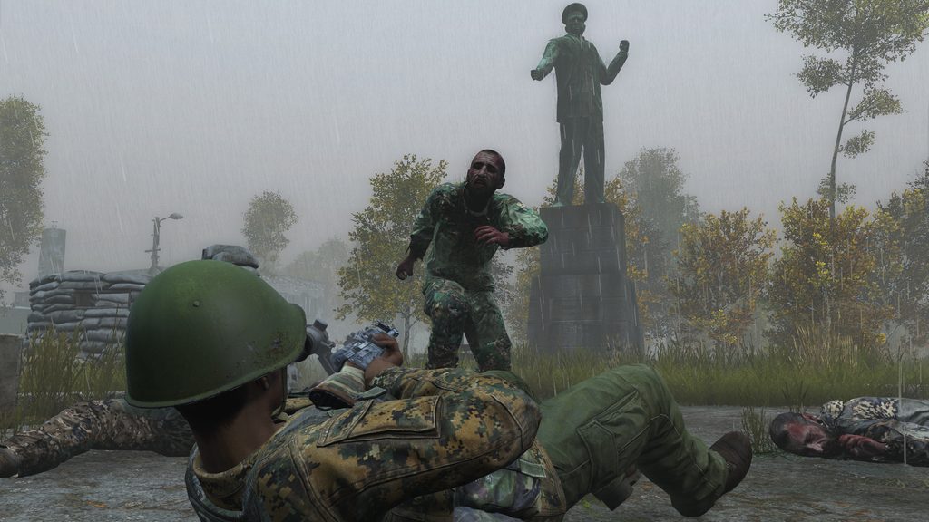 Dayz, soldado defendiendose desde el suelo del ataque de un UN ZOOMBIE